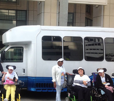 group of people in front of van